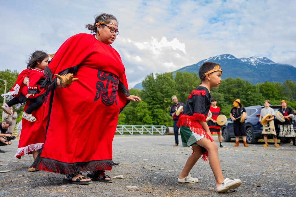 Woman and child wearing ceremonial clothing