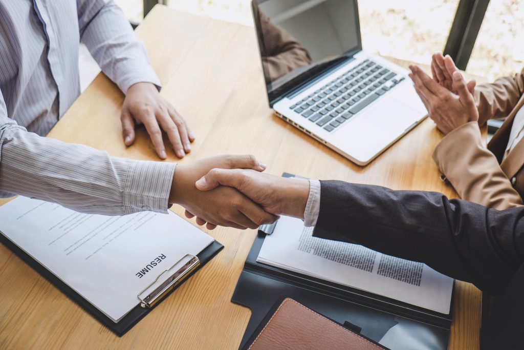 Greeting-new-colleagues-Handshake-while-job-interviewing-scaled.jpeg