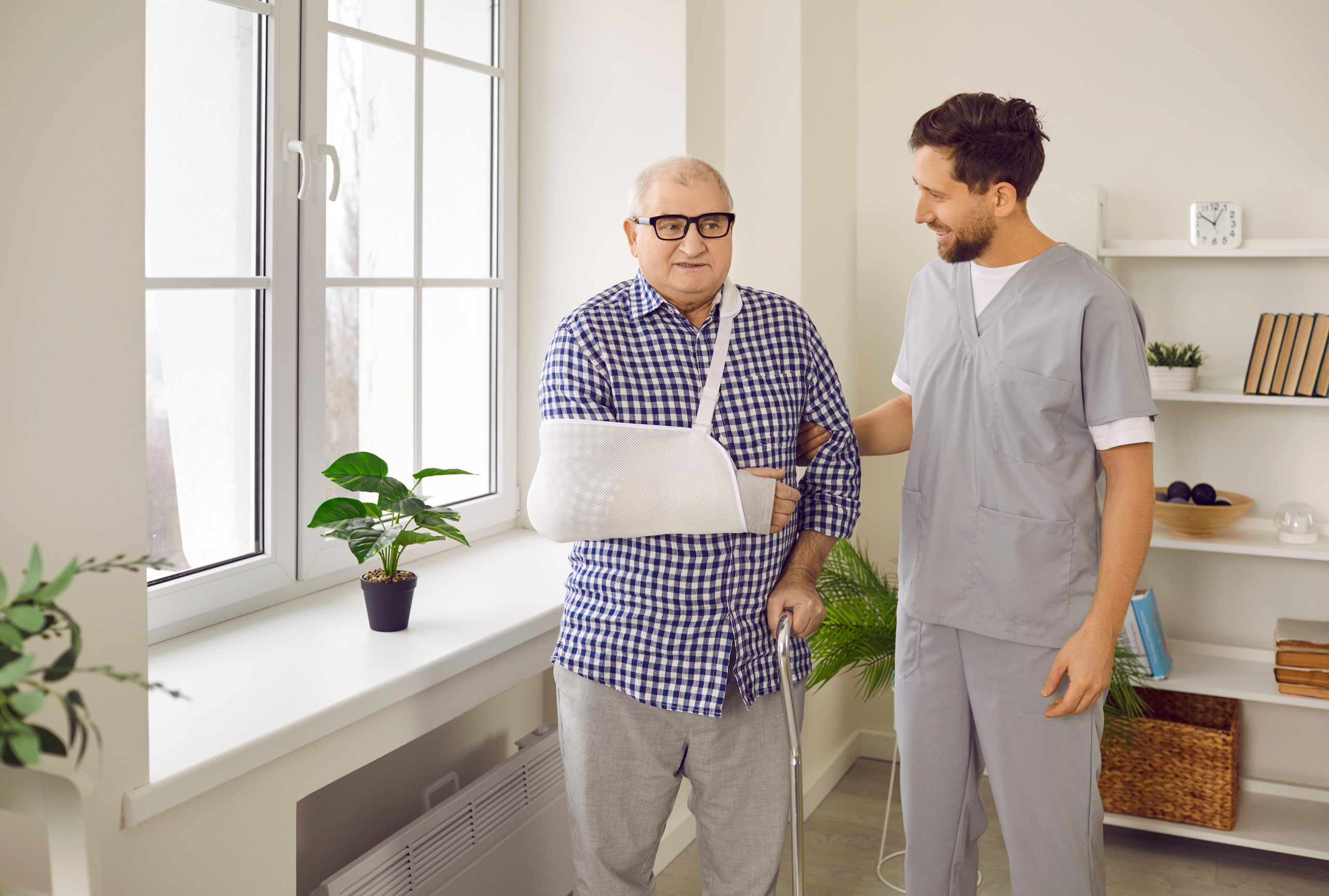 caregiver-supporting-injured-senior-patient